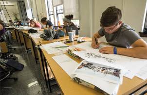 Photo of landscape architecture students working on projects during class.