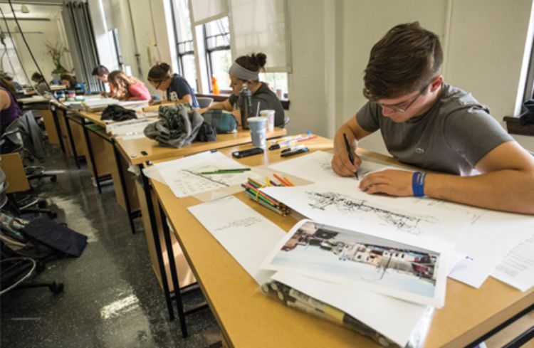 Photo of landscape architecture students working on projects during class.