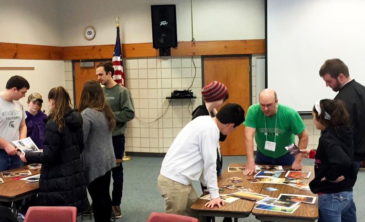 Youth and adults at the 2016 Michigan 4-H Youth Leadership and Global Citizenship Spectacular participating in an entire session on visual literacy. This photo is a representation of the activity mentioned in this article.