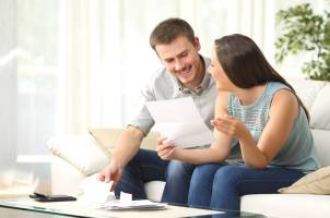 Couple reviewing financial document