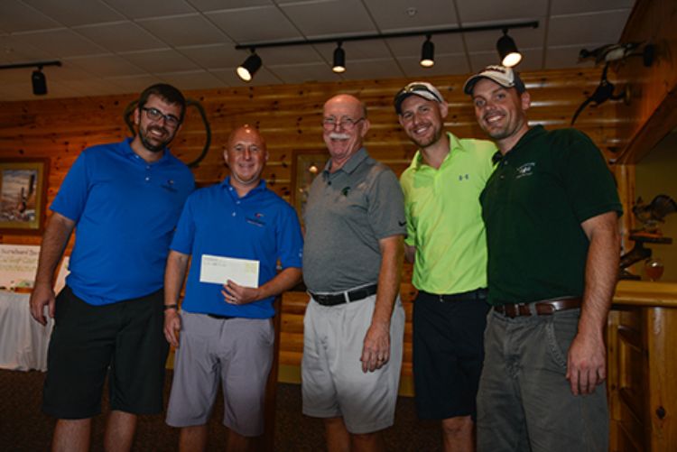 Image of the winning foursome, including Kevin Erickson, Craig Boss, Peter Crawford and Erik Cronk with Paul Nieratko.