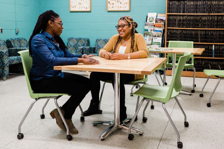 MSU Department of Forestry faculty member Asia Dowtin (left) talks with Sasha Bell, a graduate student in her second year at MSU. Bell previously studied at Medgar Evers College.