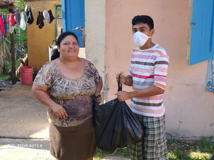 Boy delivering food to woman