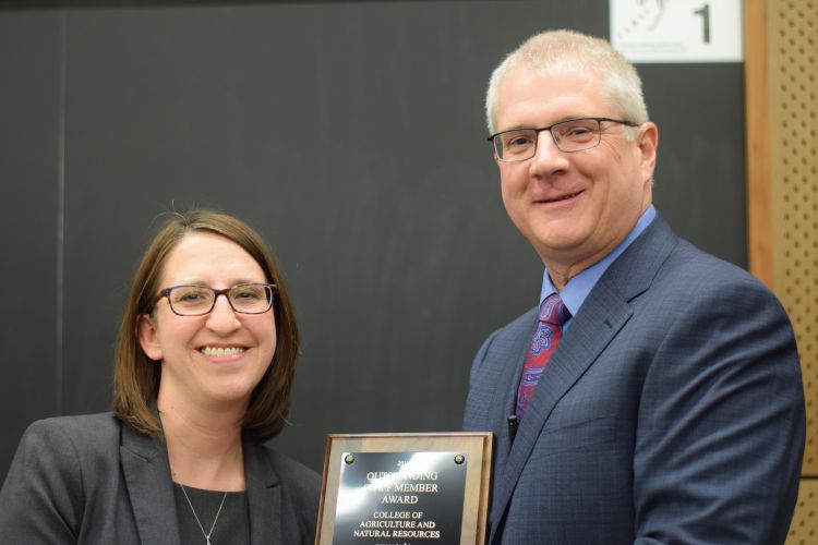 Mary Beth Graebert from the MSU School of Planning, Design and Construction receives 2019 Outstanding Staff Member Award from CANR Dean Ron Hendrick.