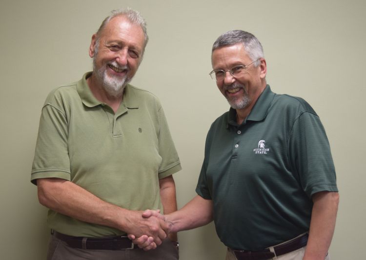 MSU Professor Emeritus Bob Hollingworth, left, with Entomology Chairperson Bill Ravlin, right.