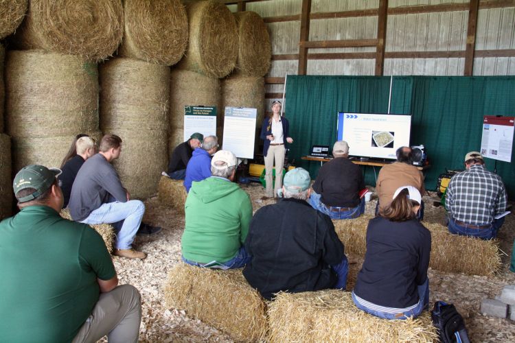 Gathering of people in a hay barn.