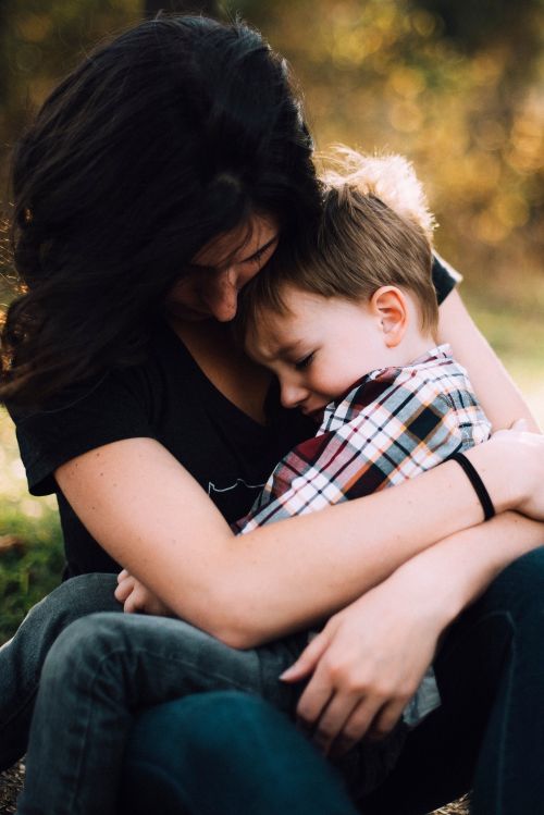 Mom hugging boy