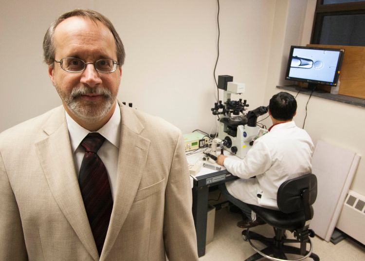 Keith Lathum, MSU animal scientist, studies the early development of unfertilized eggs