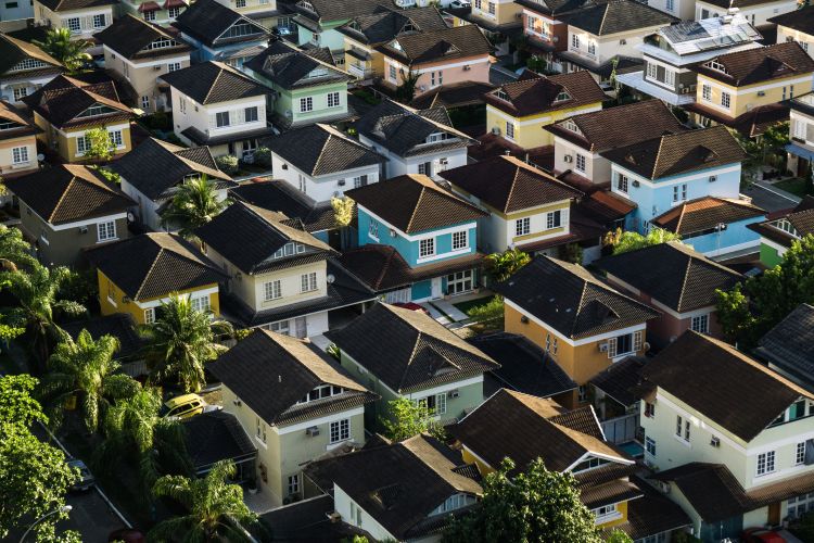 Aerial view of subdivision with tightly packed houses.