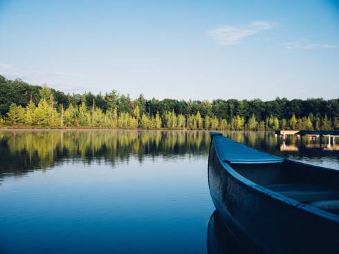 Photo of a canoe on a lake.