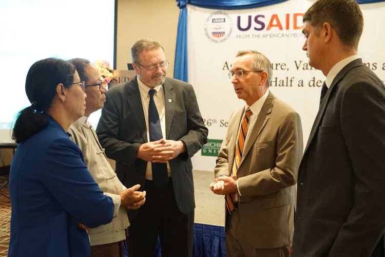 Members of the USAID Conference discussing a topic.