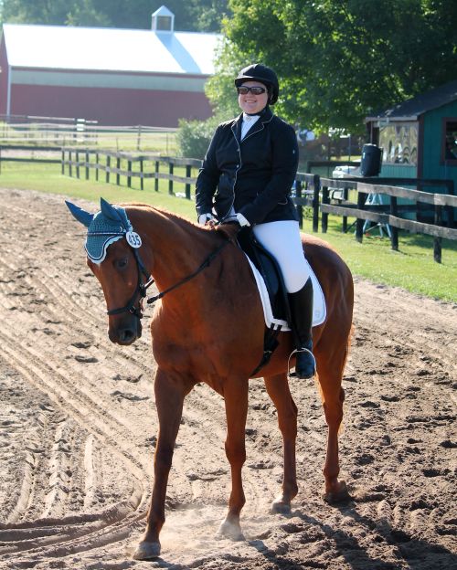 4-H alumna and student intern Aubrey Perrone riding Leo.