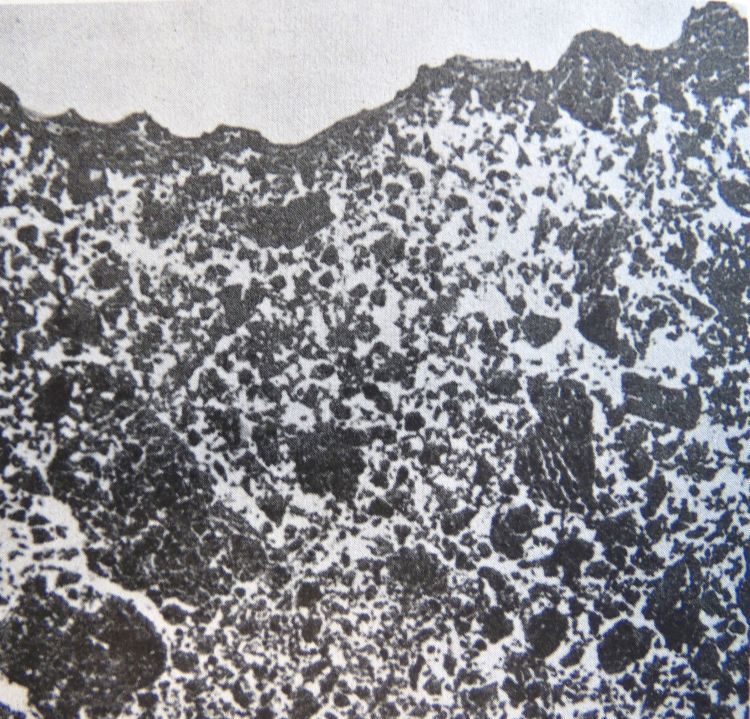 Photo 1. Microphotograph showing a very thin crust on a fine-textured soil. The white space in the photo represents the pores in the soil. Source: MSU Extension Bulletin E-1460, Compact Soil – Visual Symptoms.