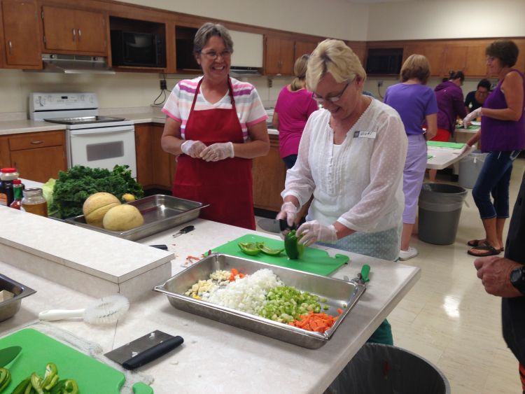 School nutrition staff participants at the Making Michigan Recipes Work training in Marquette learn skills for handling and preparing fresh Michigan produce.