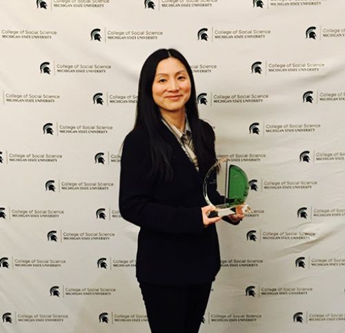 Image of Peilei Fan with her award.