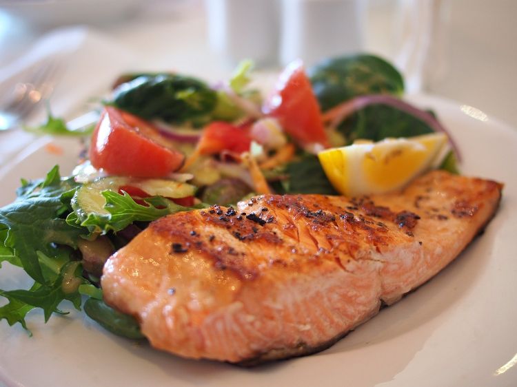 Prepared salmon on a dinner plate.