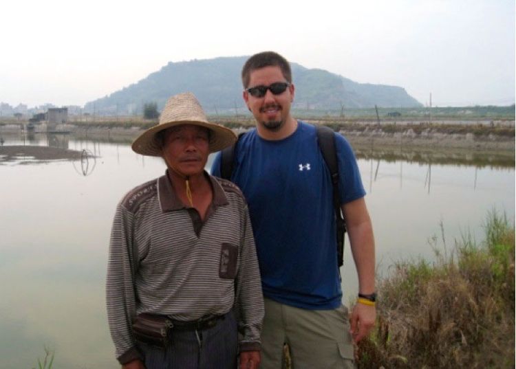 David Ortega poses with a Chinese farmer in Fujian Province, China, in 2011.