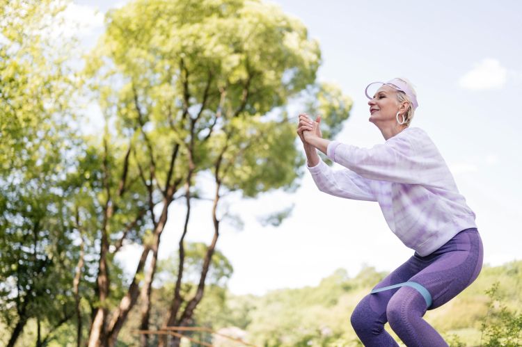 A woman exercising in the park.