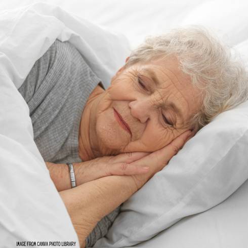 Elderly women sleeping in bed