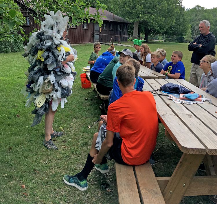The Bag Monster talking with campers about plastic pollution.