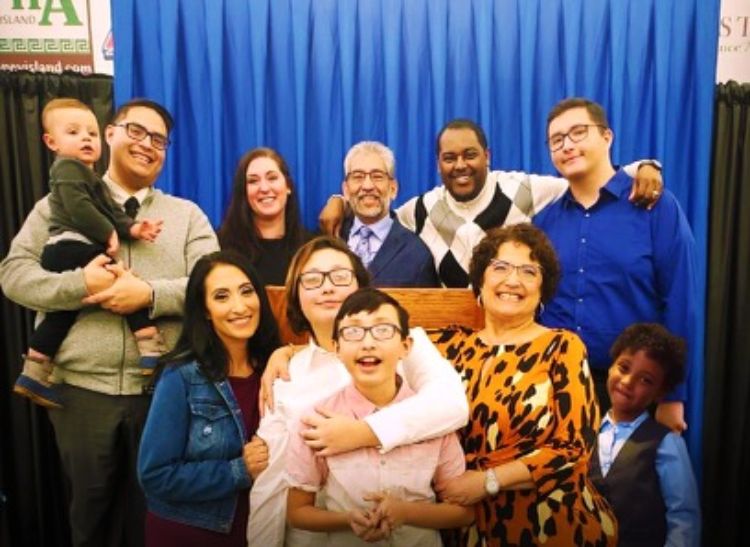 Dionardo Pizaña (back center), a diversity, equity and inclusion specialist for Michigan State University Extension, and his family.