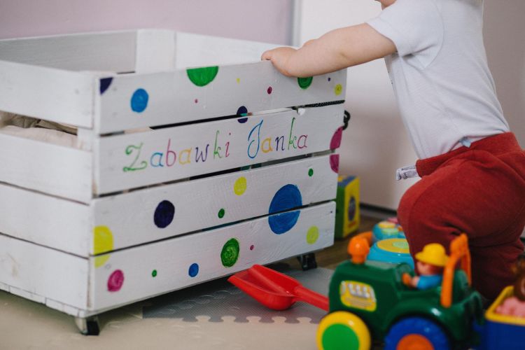 A child and a toy box.