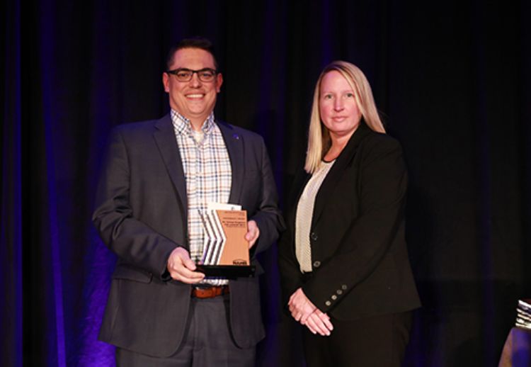 Image of George Berghorn receiving his award.