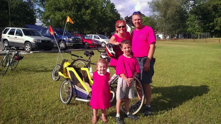 Wiesler family in front of bike.