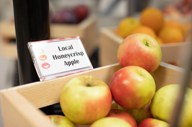 Wooden bin filled with local honeycrisp apples.