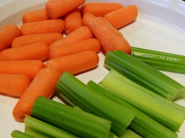 Carrots and celery sticks on a plate.