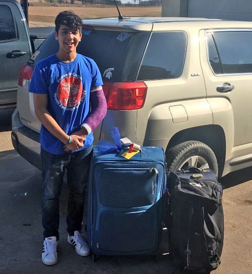 Exchange student with his luggage