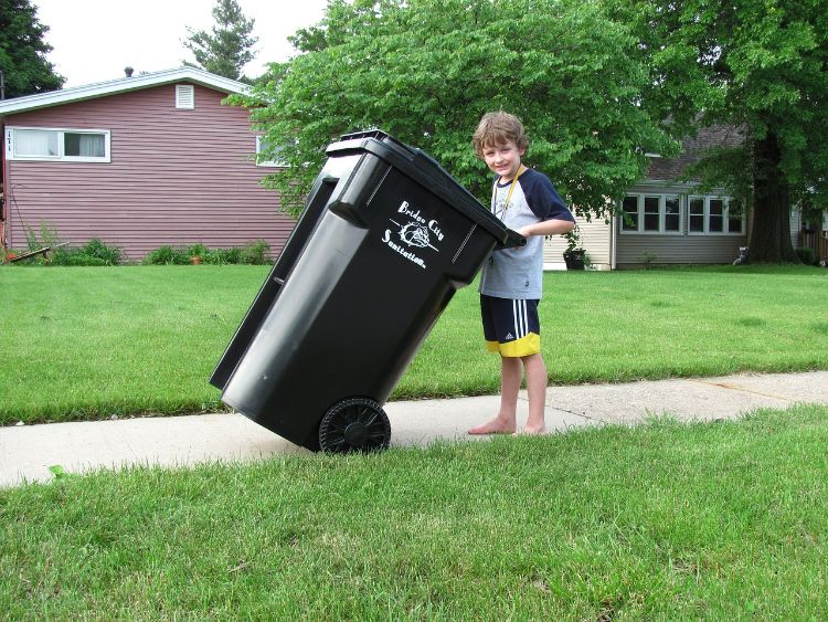 Most 5-year-olds can begin to take out the trash.