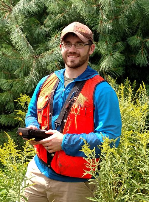 Jason Darling standing in the woods