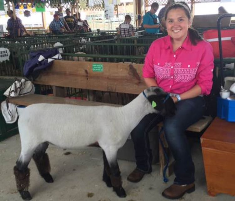 MacKenzie McInnis and her lamb at a county fair.