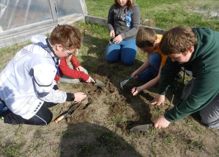 Platte River Elementary students prepare their school garden beds for planting