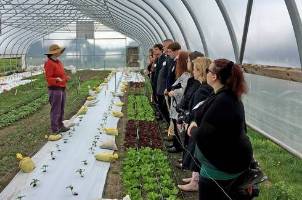 Students touring greenhouse.