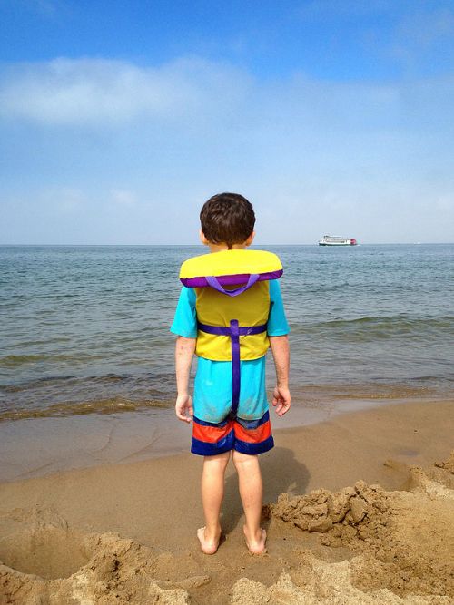 Small children should wear life vests at the beach. Photo: Todd Marsee | Michigan Sea Grant