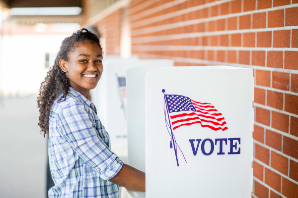 Young woman in a voting booth