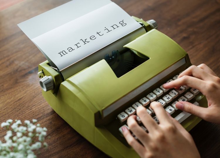 Someone typing on a typewriter