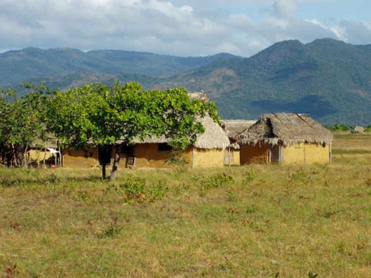  Amerindian houses in the Rupununi Region. The Rupununi Mountain Range is visible in the background.