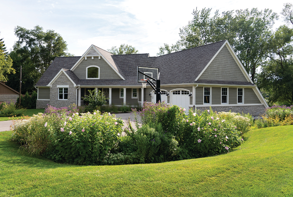 Large house with short cut grass.