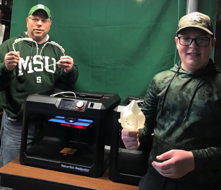 MSU faculty member Phil Hill and his son, Eddie, have been printing masks and face shield components to support a local coronavirus initiative.