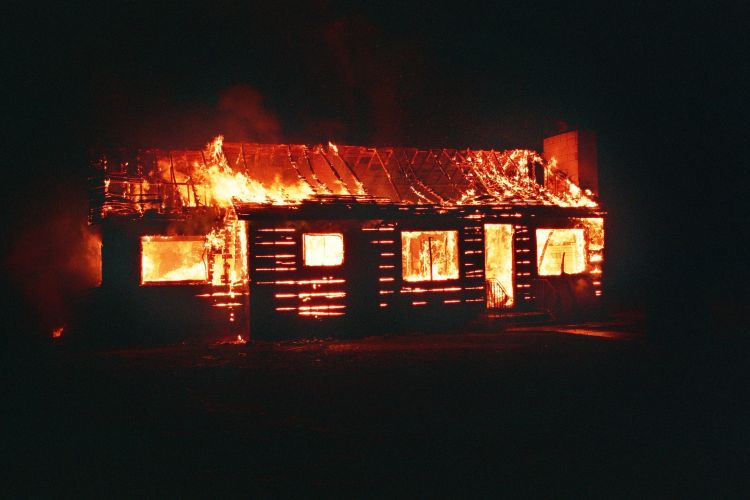 A structure engulfed in flames.
