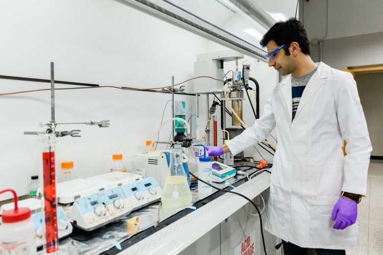 MSU Forestry doctoral student Saeid Nikafshar formulating lignin-based polyurethane adhesive.