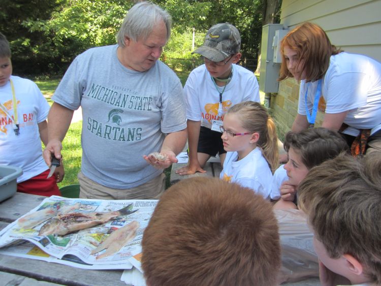 Mark Stephens from Project F.I.S.H. teaches campers about fish anatomy. Katy Hintzen | Michigan Sea Grant