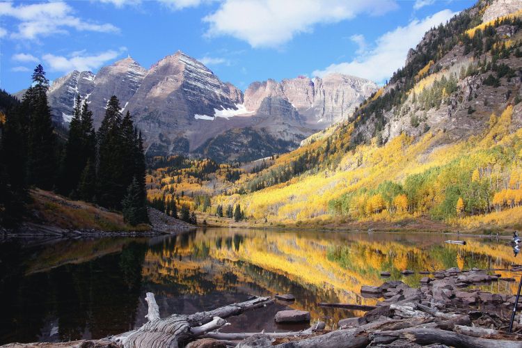 A decorative image of a river and mountain view.