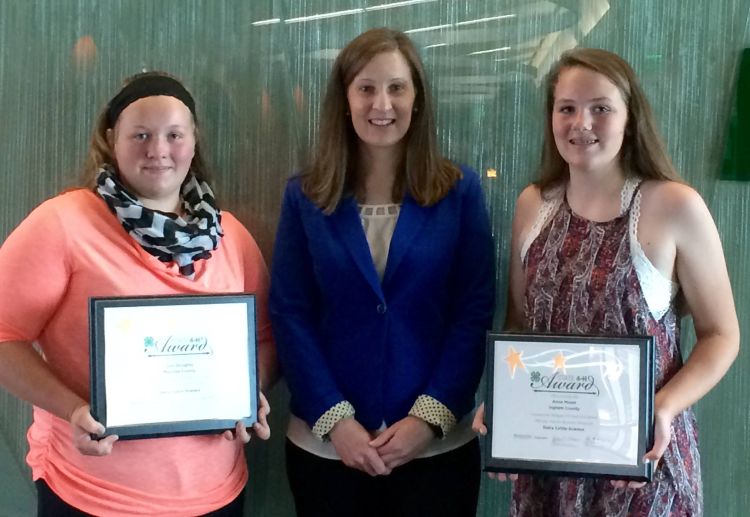 Jolene Griffin (center) from United Dairy Industry of Michigan with Senior 4-H State Award winner Julia Doughty (left) and Junior 4-H State Award Winner Anna Moser (right).