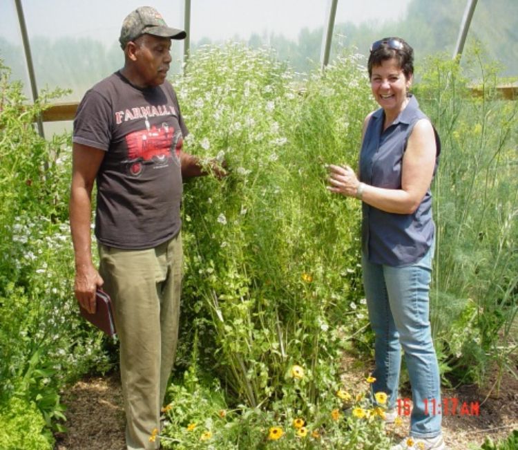 Napier-Dunnings, pictured with Cornelius Williams, MIFFS Farmer of the Year Award Winner, is the Executive Director of MIFFS.