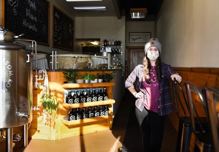Caley Gunthorpe in her tap room in East Lansing. Photo Credit to Lansing State Journal