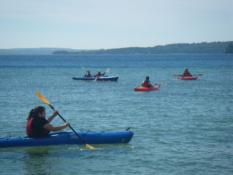 Life of Lake Superior youth kayaking on South Bay out from Munising, MI. (Photo by MSU Extension)